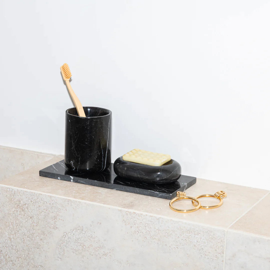 https://theancienthome.com/cdn/shop/products/002-SCRO9001010-black-marble-toothbrush-holder_1800x1800.webp?v=1689331671