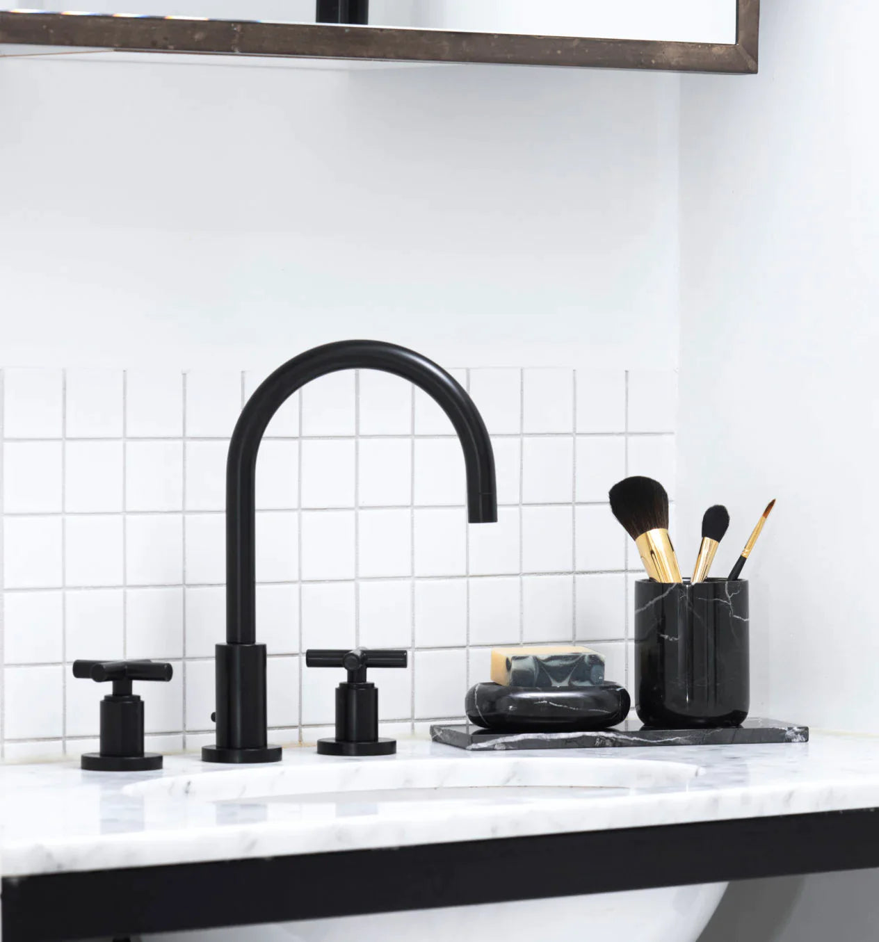 https://theancienthome.com/cdn/shop/products/003-SCRO9001010-black-marble-toothbrush-holder_1800x1800.webp?v=1689332020